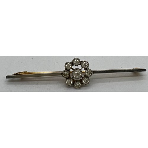 590 - An unmarked yellow and white metal diamond set bar brooch 6.5cm l.