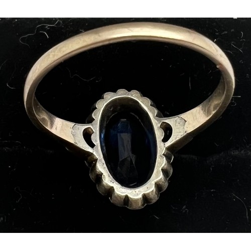 583 - A blue & clear stone ring marked 9ct to shank, size O, weight 3gm.