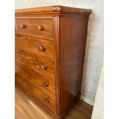 118 - A 19thC mahogany chest of 2 short over 4 long drawers with wooden knobs and bun feet. 126 w x 53 d x... 