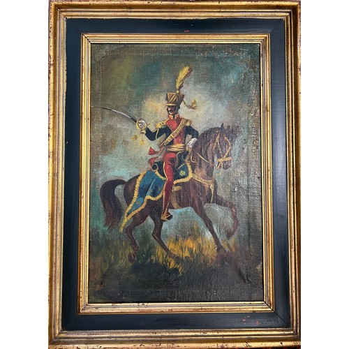 1309 - Oil on canvas of soldier on horseback in gilt and painted frame. 61 x 40cm.