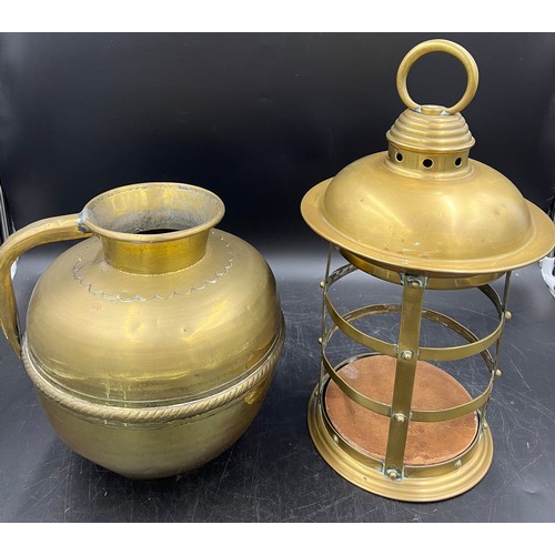 934 - A vintage brass jug and brass open lantern. 43cm h.