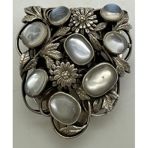 576 - An early 20thC white metal moonstone set dress clip. Weight 18.5g. Size 4 x 3.5cm.