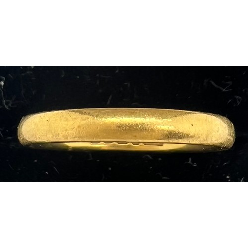 579 - A 22ct gold wedding band. Weight 3.1gm. Size K/L.