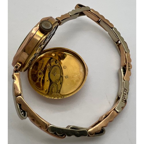 916 - A 9ct gold cased ladies wristwatch on expanding rolled gold bracelet in original presentation case. ... 