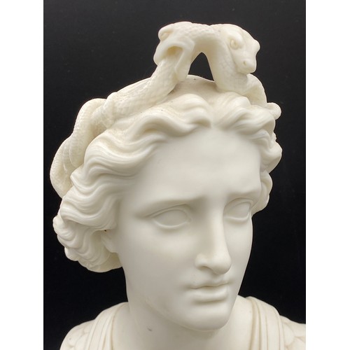 366 - A male Parian bust with snakes to hair and decorative uniform. 23cm h.