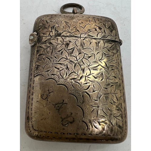 910 - A hallmarked silver foliate engraved vesta case. Birmingham 1898 maker J R Ltd, initialled to front ... 