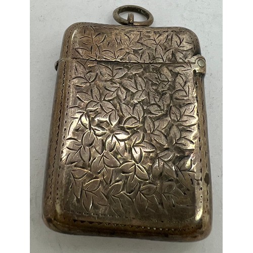 910 - A hallmarked silver foliate engraved vesta case. Birmingham 1898 maker J R Ltd, initialled to front ... 