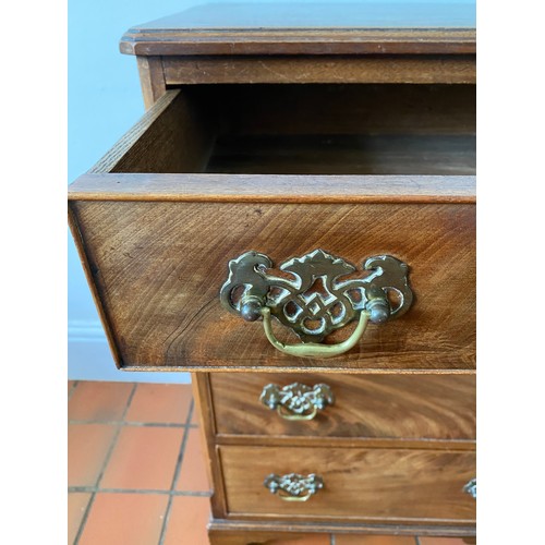 125 - A 20thC four height mahogany chest of drawers on bracket feet and brass handles. 82 h x 57.5 w x 40c... 