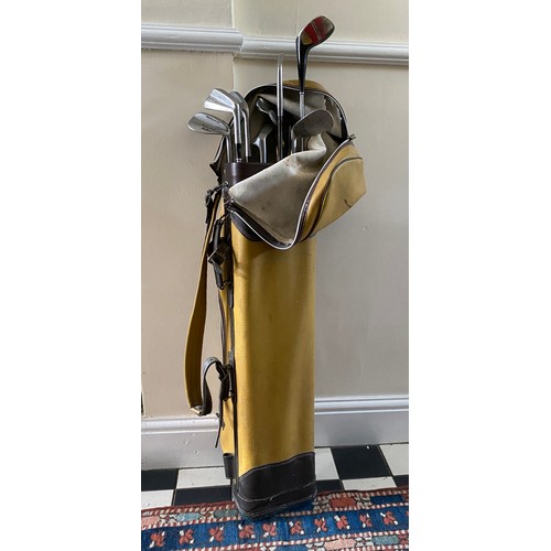 1089 - A collection of golf clubs to include a selection of various irons of different makes with bag and b... 