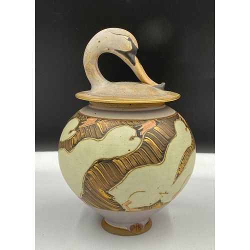 373 - Michael and Barbara Hawkins, a lidded stoneware bowl with swan decoration and swan head handle to to... 