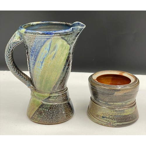 374 - Jane Hamlyn (b. 1940) a salt glazed stoneware jug and pot. Impressed marks to bases. 23cm h jug. 15c... 