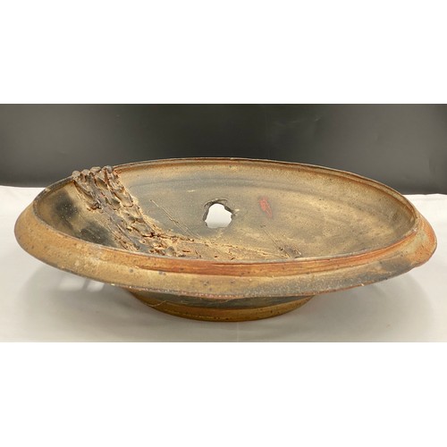 376 - Charles Bound (b.1939) Large wood fired bowl of abstract design with holes and fish design with impr... 