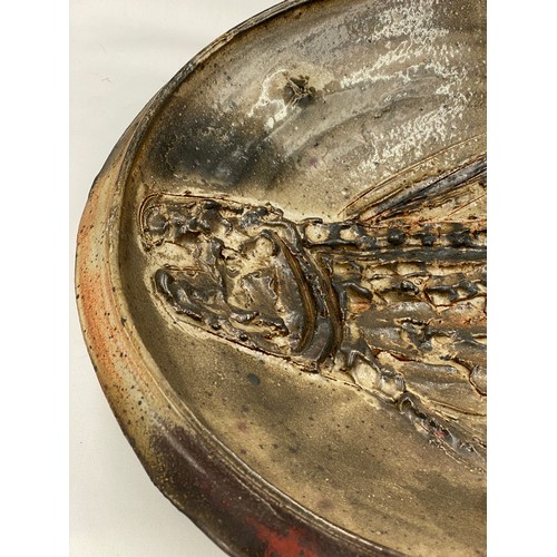 376 - Charles Bound (b.1939) Large wood fired bowl of abstract design with holes and fish design with impr... 