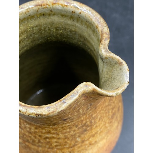 379 - A studio Pottery jug by Sarah Walton (b.1945) with ridged form, mark to base. 13cm h together with t... 