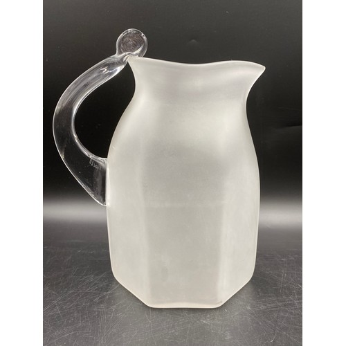 485 - Studio glass jug by Steven Newell of compressed ovoid form with waisted collar neck 27cm h, signed t... 