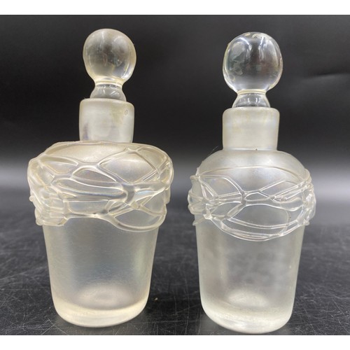 494 - David Wallace, studio glass opalescent x 4 bottles and 3 stoppers. All etched to base, three with da... 