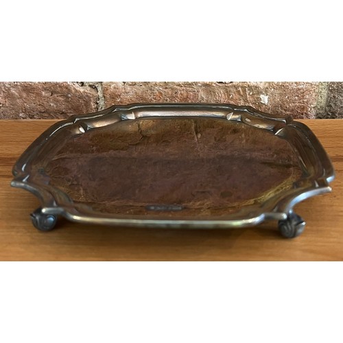 882 - A silver card tray raised on scroll feet, Sheffield 1978, maker Parkin Silversmiths Ltd. 19 x 19cm.