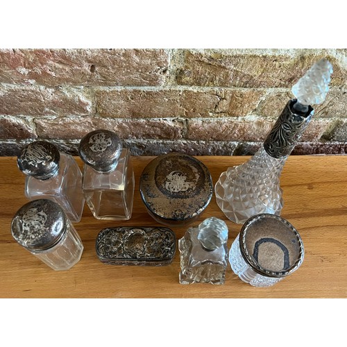 885 - Silver lidded/ collared  glass scent bottles and jars. Various dates and makers.