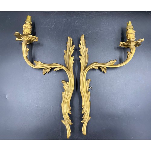 1073 - A pair of French metal and gilt single branch wall sconces. 43cm h approx.