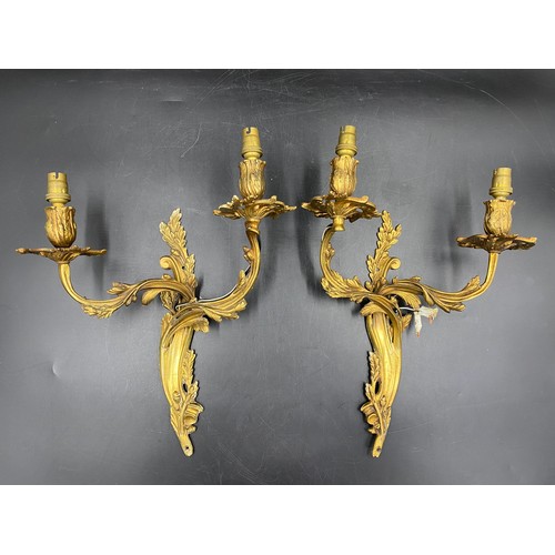 1074 - A pair of French metal and gilt single branch wall sconces, acorn decoration. 35cm h approx.