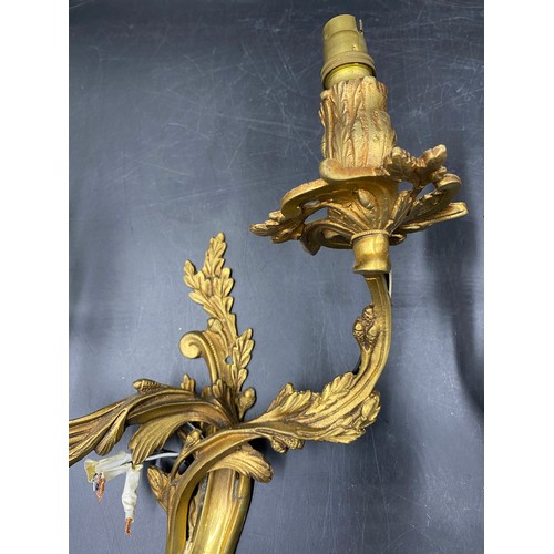 1074 - A pair of French metal and gilt single branch wall sconces, acorn decoration. 35cm h approx.