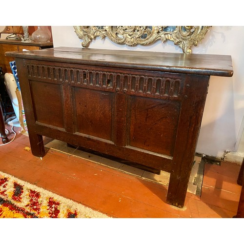 131 - An 18thc oak coffer with carved decoration to frieze. 118 l x 51 d x 70cm h.