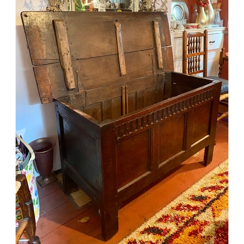 131 - An 18thc oak coffer with carved decoration to frieze. 118 l x 51 d x 70cm h.