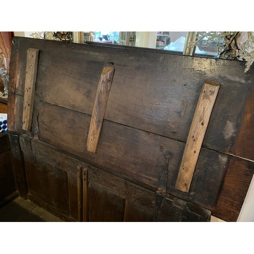 131 - An 18thc oak coffer with carved decoration to frieze. 118 l x 51 d x 70cm h.