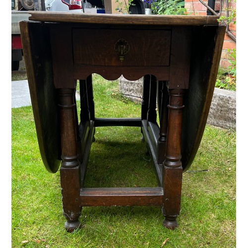 134 - Oak gate leg table with drawer to each end. 143 x 183cm open x 74.5cm h.