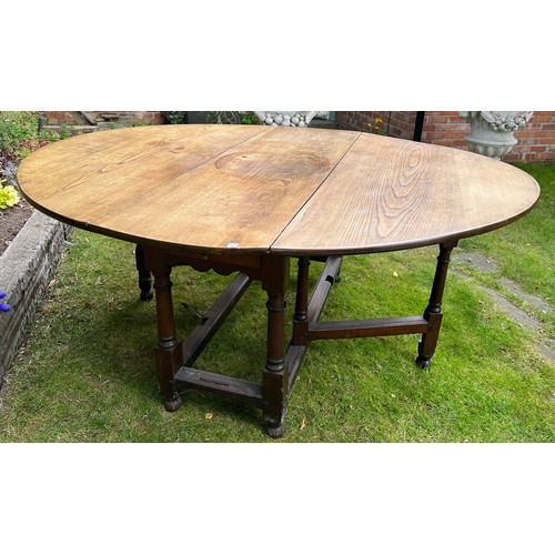 134 - Oak gate leg table with drawer to each end. 143 x 183cm open x 74.5cm h.