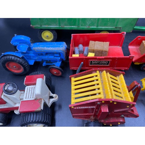 972 - A collection of Britains diecast toys to include Vermeer Round Baler x 2, MF200 Massey Ferguson Trai... 