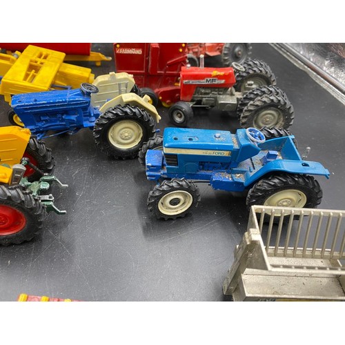 972 - A collection of Britains diecast toys to include Vermeer Round Baler x 2, MF200 Massey Ferguson Trai... 