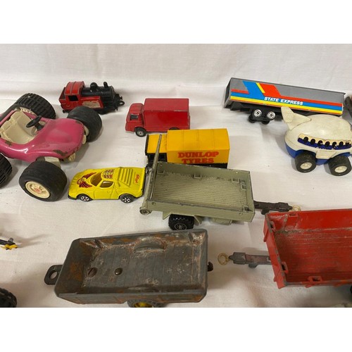 973 - A collection of diecast toys to include Dinky trailer, Matchbox Super Kings trailer, Corgi British L... 