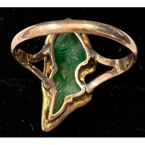 603 - An 18ct gold ring set with jade in the form of a fish, Size L. 2.1gm.