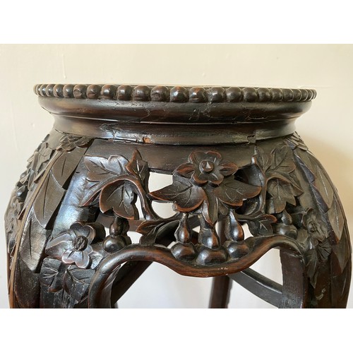 757 - Floral and foliate carved Chinese hardwood stand with marble top on 4 legs. 92cm h x 20cm d at top.