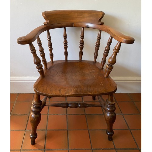 129 - An oak Captains chair. 79 h x 48cm w.