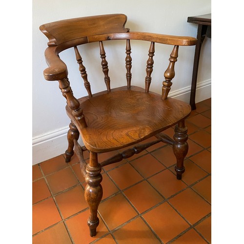 129 - An oak Captains chair. 79 h x 48cm w.