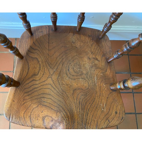 129 - An oak Captains chair. 79 h x 48cm w.