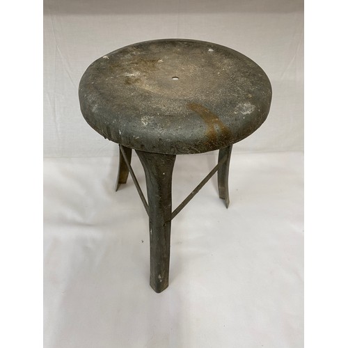 205 - A galvanised milking stool. 35cm h x 26cm diameter.