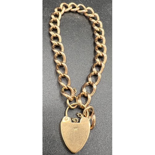 612 - A 9ct gold bracelet with heart shaped padlock and two spare links. 10.9gm.