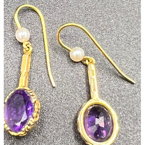 617 - Nine carat gold earrings set with amethyst and seed pearls. 2.2gm.