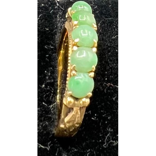 620 - A 22 carat gold ring set with jade, size L, 3.6gm.