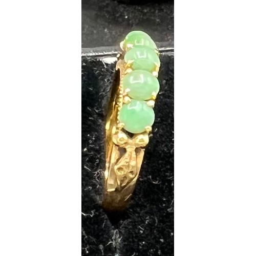 620 - A 22 carat gold ring set with jade, size L, 3.6gm.