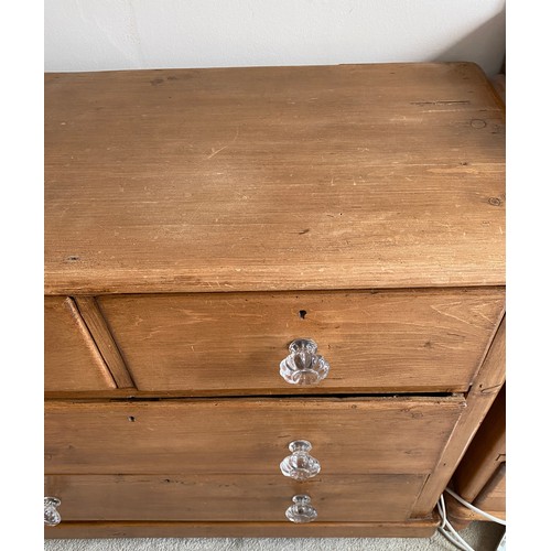 135 - Pine chest of drawers, 2 short drawers over 2 long with glass knobs. 81 h x 98 w x 45cm.