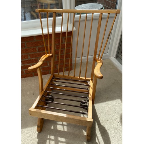 138 - A mid century pale beech rocking chair. 88 h x 70cm w.