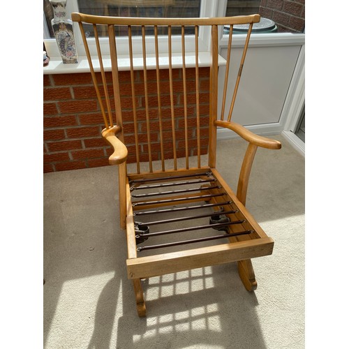 138 - A mid century pale beech rocking chair. 88 h x 70cm w.