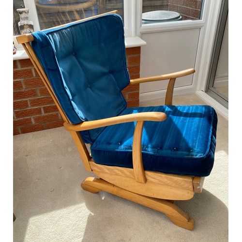 138 - A mid century pale beech rocking chair. 88 h x 70cm w.