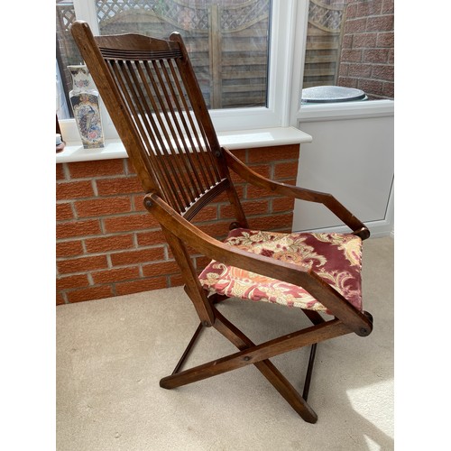 139 - A 19thC folding armchair with fabric seat. 96 h x 48cm w.