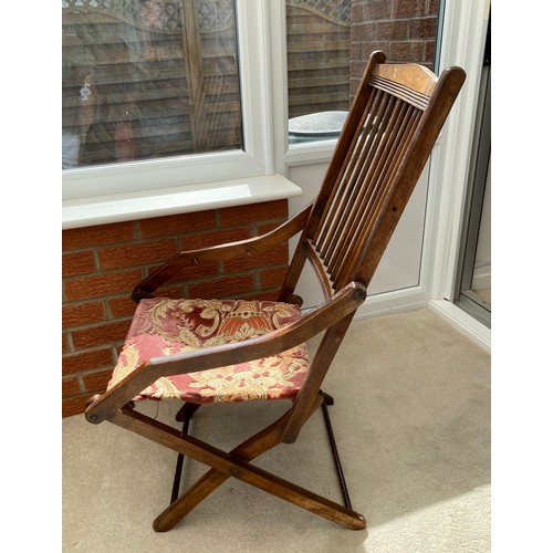 139 - A 19thC folding armchair with fabric seat. 96 h x 48cm w.