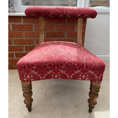 140 - A 19thC occasional chair with turned front legs and upholstered top rail on castors. 67 h x 51 w to ... 